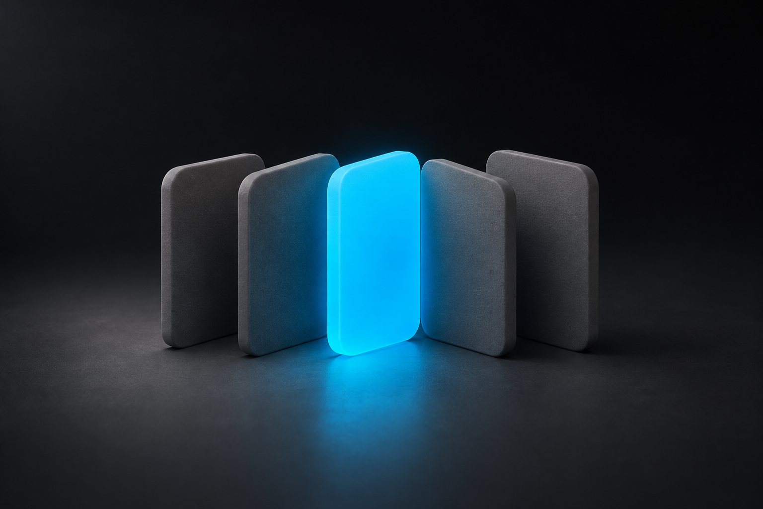 A row of grey index cards standing upright; one card is blue.